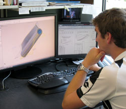 Image of a man looking at a computer
